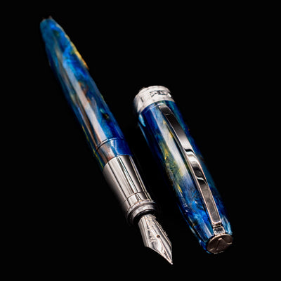 Visconti Van Gogh Starry Night Fountain Pen with cap beside body, emphasizing polished clip and brilliant resin.