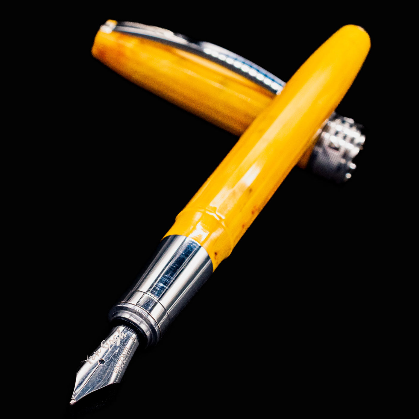 Close-up of Visconti Van Gogh Sunflowers Fountain Pen nib and marbled yellow resin body