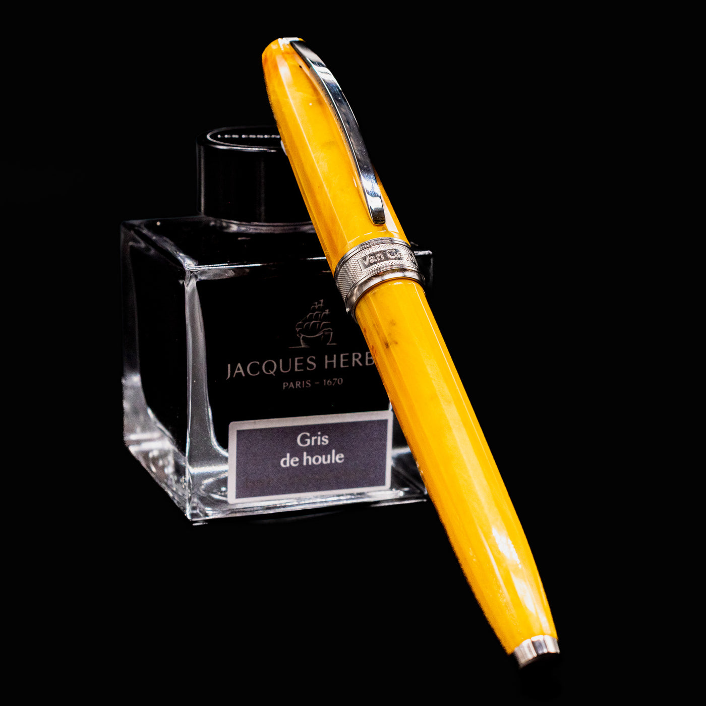 Visconti Van Gogh Sunflowers Fountain Pen leaning against Jacques Herbin Gris de Houle ink bottle