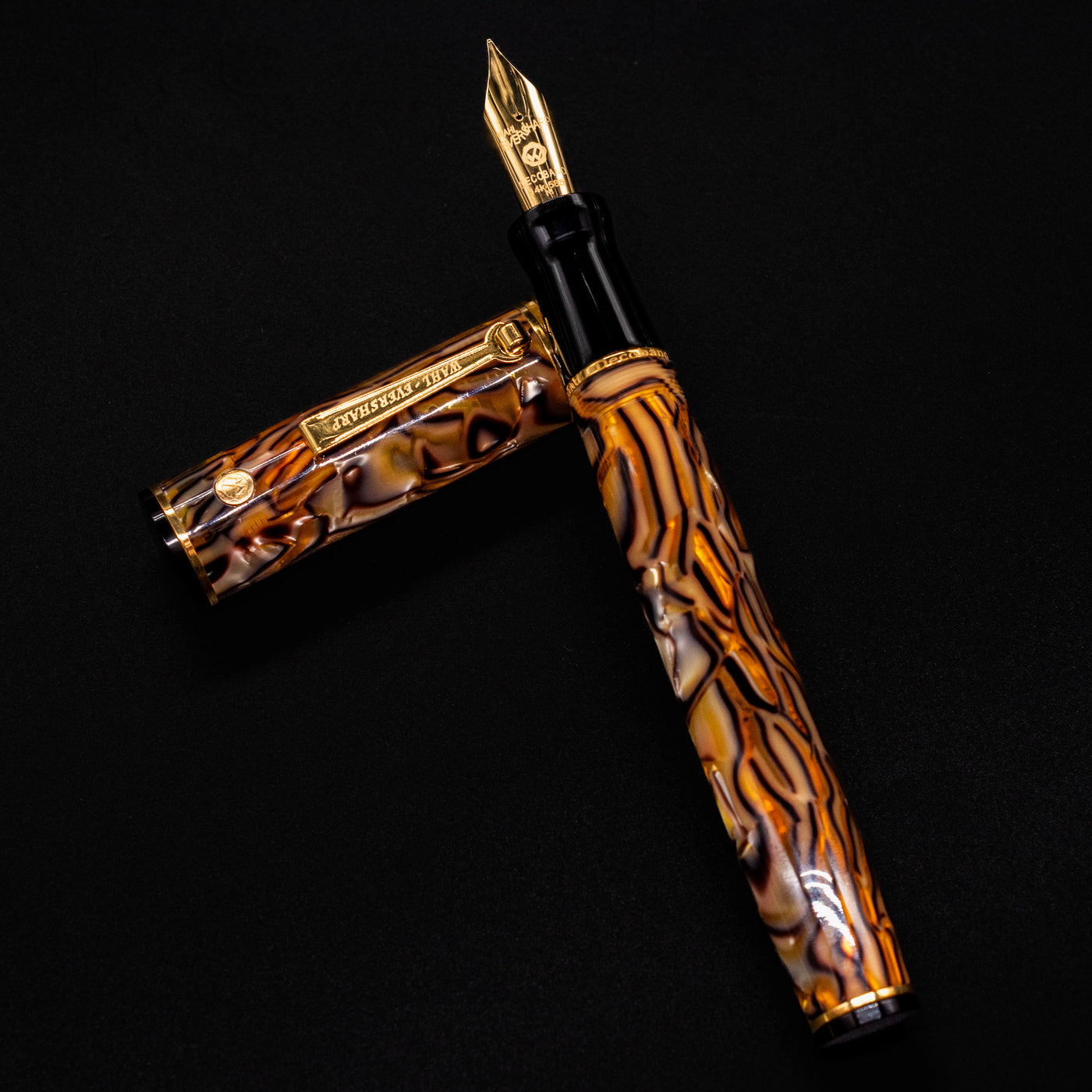 Wahl Eversharp Decoband Fountain Pen in Cracked Ice with gold nib and cap beside the barrel