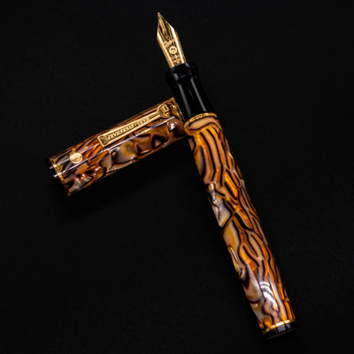 Wahl Eversharp Decoband Fountain Pen in Cracked Ice with gold nib and cap beside the barrel