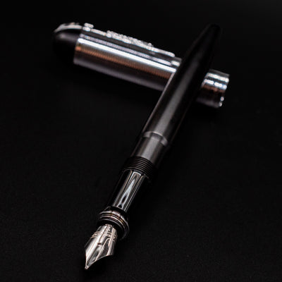Diagonal angle of the uncapped Wahl Eversharp Skyline Fountain Pen - Black & Chrome with cap placed behind the pen.