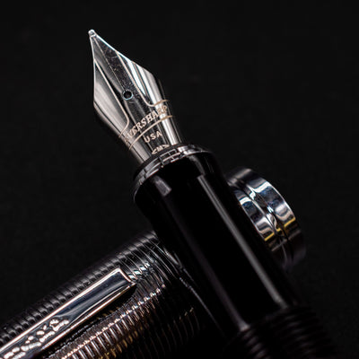 Detailed macro of the Wahl Eversharp Skyline Fountain Pen nib with chrome finish, engraved with "EVERSHARP USA."