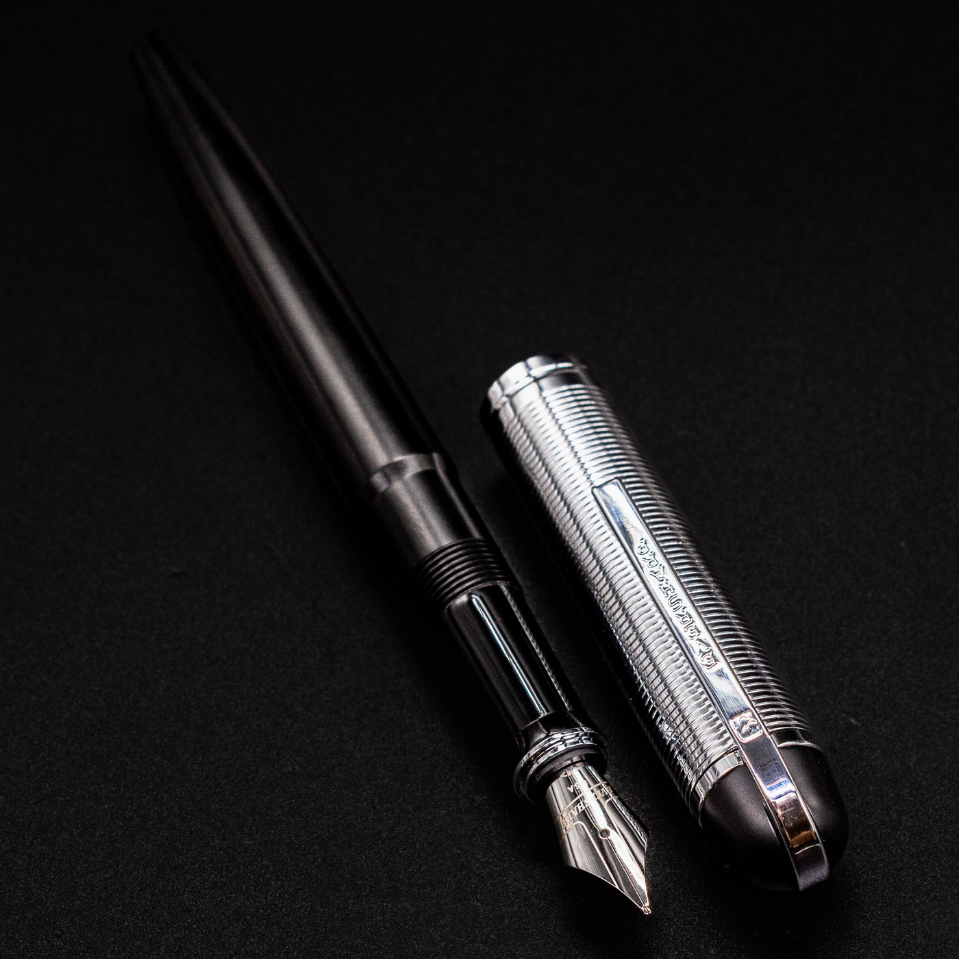 Side-by-side view of the uncapped Wahl Eversharp Skyline Fountain Pen - Black & Chrome, highlighting the barrel and cap details.