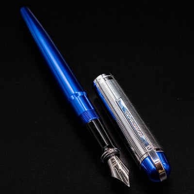 Side angle of the uncapped Wahl Eversharp Skyline Fountain Pen in vibrant blue with chrome cap.