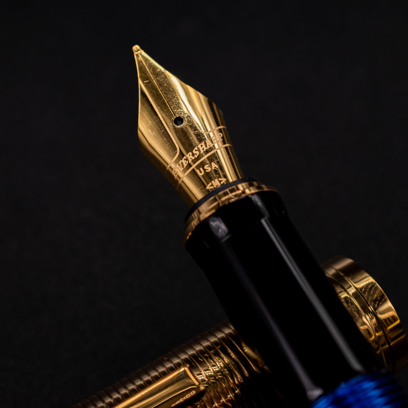 Close-up of the gold nib on the Wahl Eversharp Skyline Fountain Pen - Blue & Gold showing engraved details.