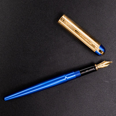 Wahl Eversharp Skyline Fountain Pen - Blue & Gold displayed open on a black background with the cap placed above.