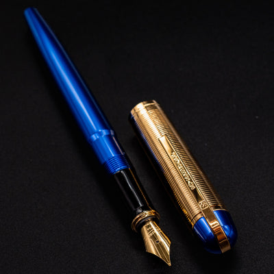 Side angle of the open Wahl Eversharp Skyline Fountain Pen - Blue & Gold showing the full blue barrel and gold cap.