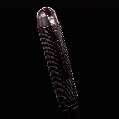 Close-up of the Wahl Eversharp Skyline Fountain Pen - Aviator Black cap with deep black metallic finish and engraved clip.