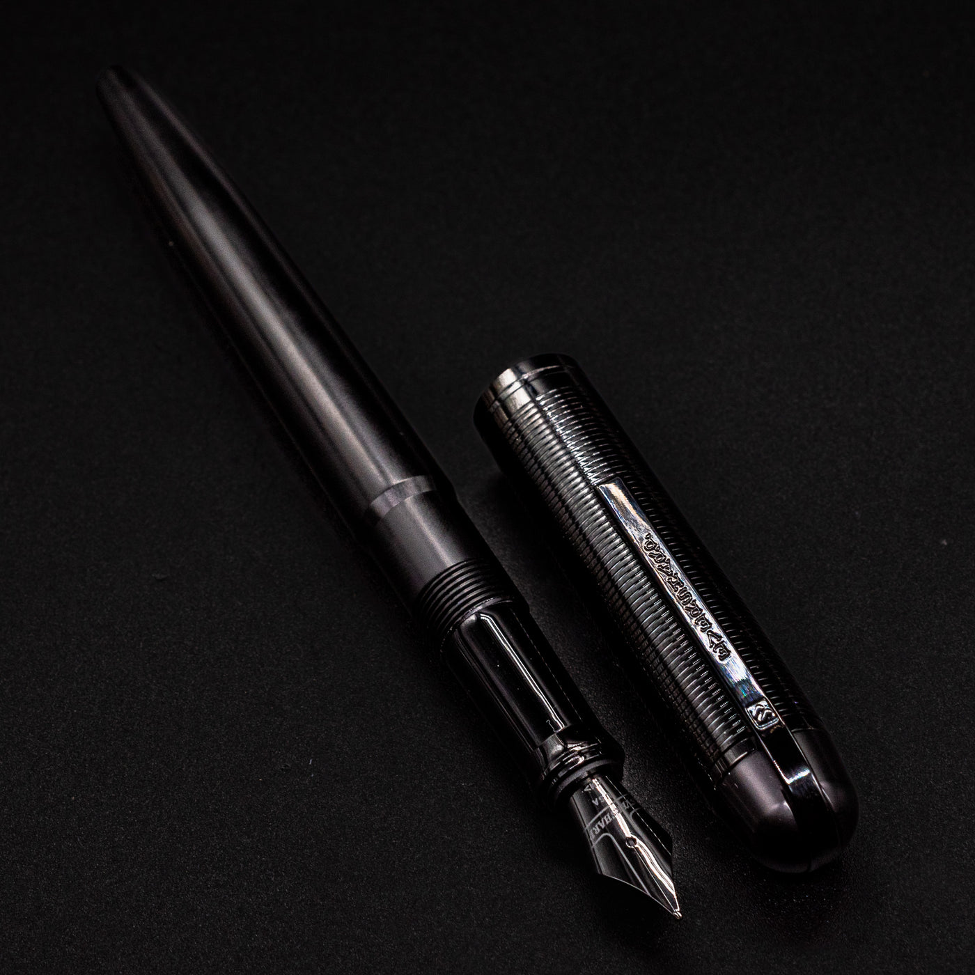 Wahl Eversharp Skyline Fountain Pen - Aviator Black lying diagonally with cap beside the barrel.