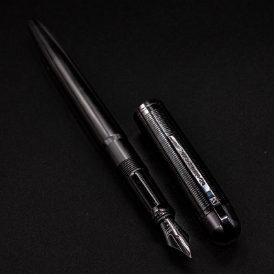 Wahl Eversharp Skyline Fountain Pen - Aviator Black lying diagonally with cap beside the barrel.