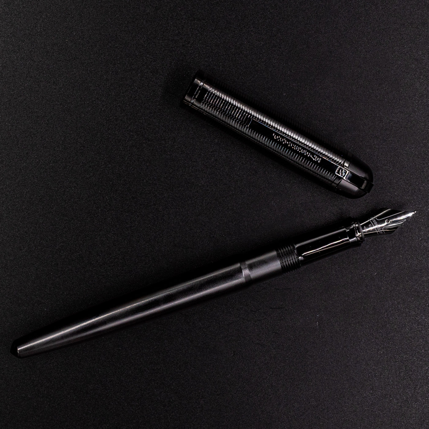 Wahl Eversharp Skyline Fountain Pen - Aviator Black uncapped and viewed from above on black background.