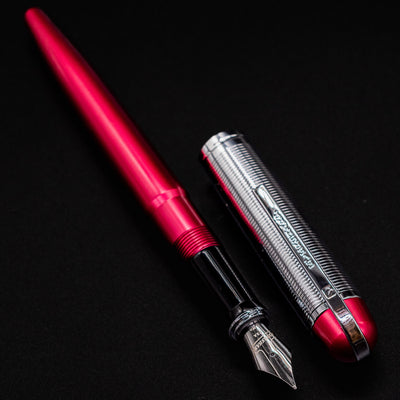 Angled flatlay of the Wahl Eversharp Skyline Fountain Pen - Red & Chrome uncapped