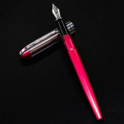 Side view of the uncapped Wahl Eversharp Skyline Fountain Pen in Red & Chrome