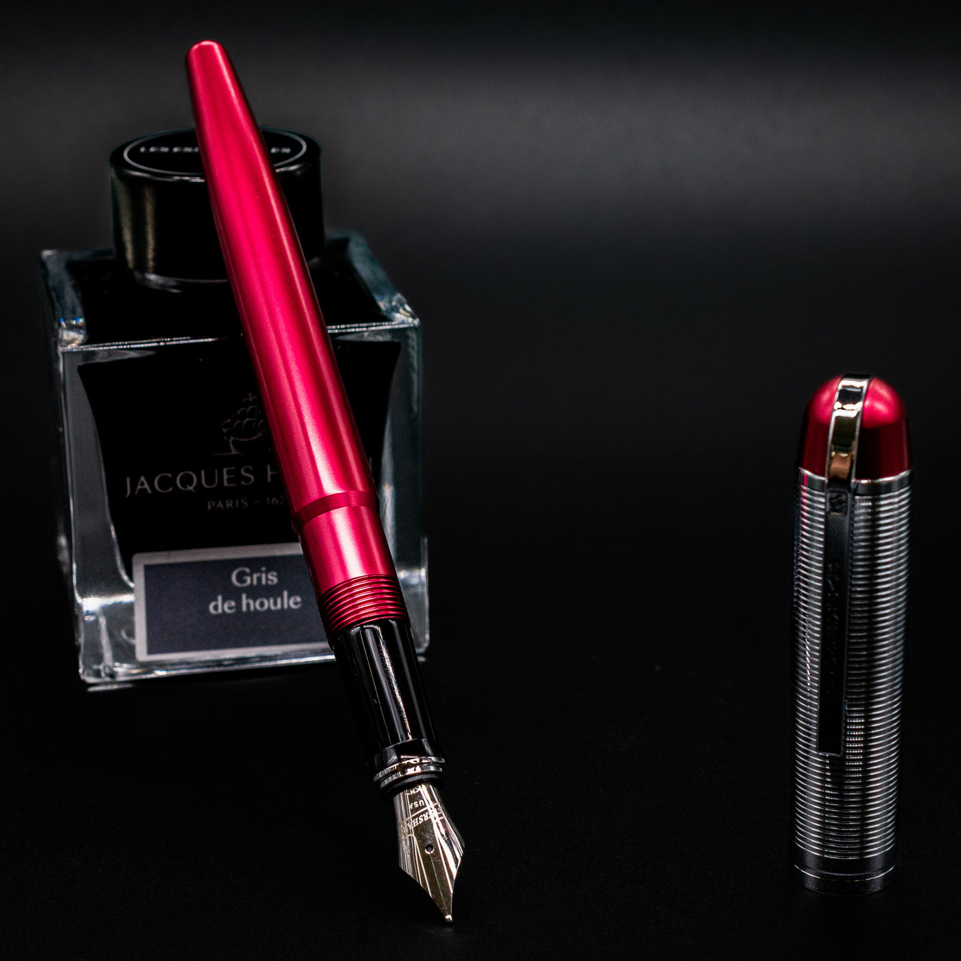 Wahl Eversharp Skyline Fountain Pen - Red & Chrome open next to Jacques Herbin Gris de Houle ink bottle