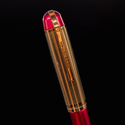 Close-up of the Wahl Eversharp Skyline Fountain Pen cap in Red & Gold finish showing detailed clip engraving.