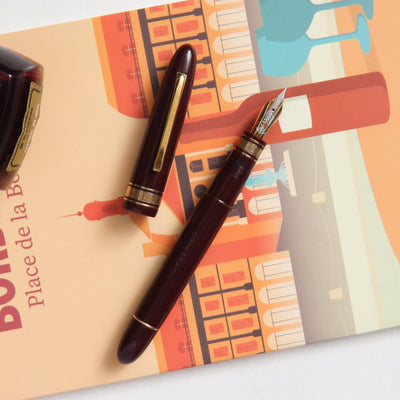 Omas 557S Burgundy & Gold Fountain Pen - Preowned Resin