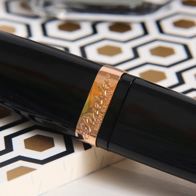 Pineider Modern Times Black & Rose Gold Rollerball Pen Logo