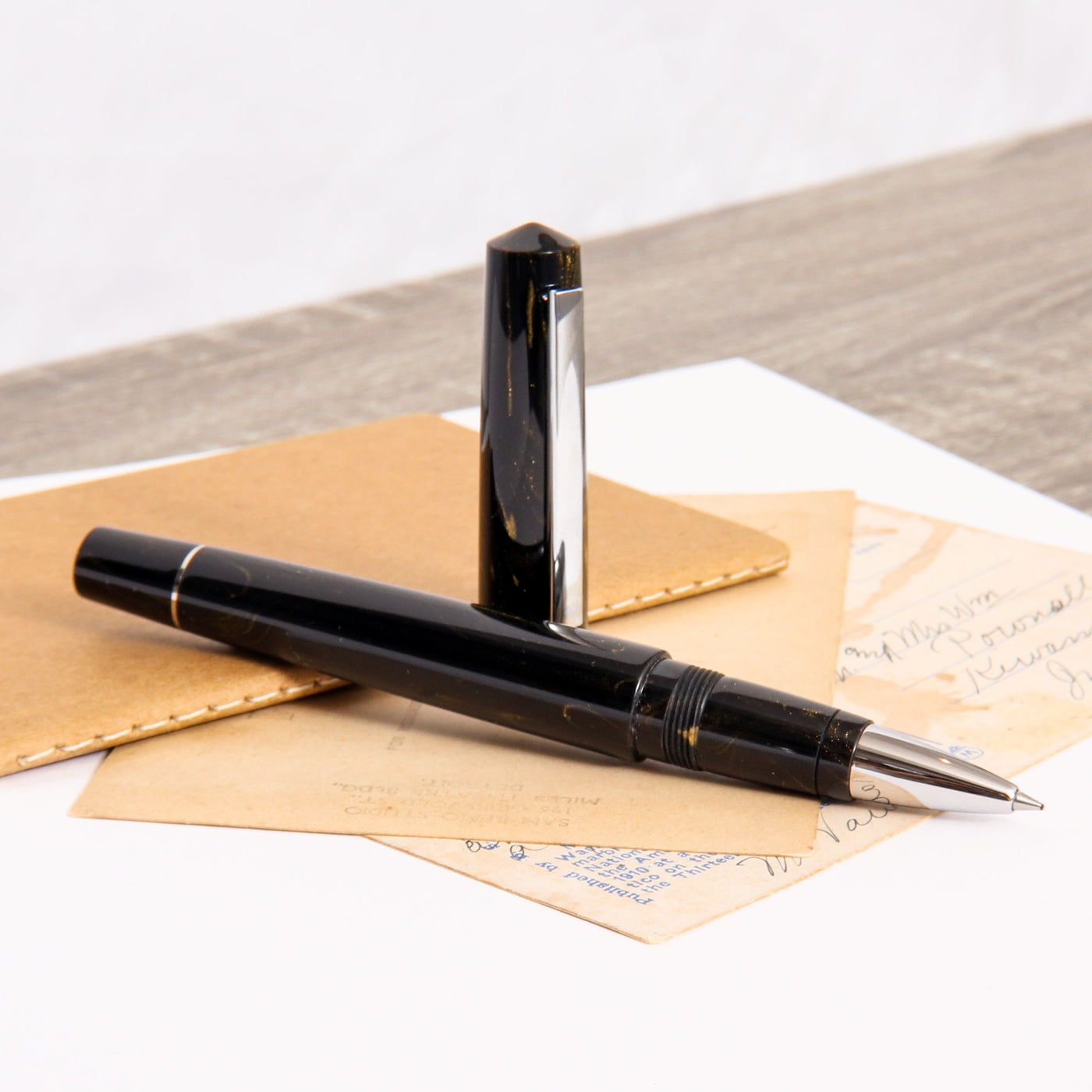 Tibaldi-Infrangible-Black-Gold-Rollerball-Pen-Uncapped